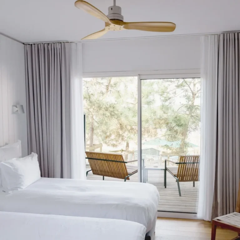 View of the Hortensias du Lac superior lake view room and its balcony overlooking Lake Hossegor
